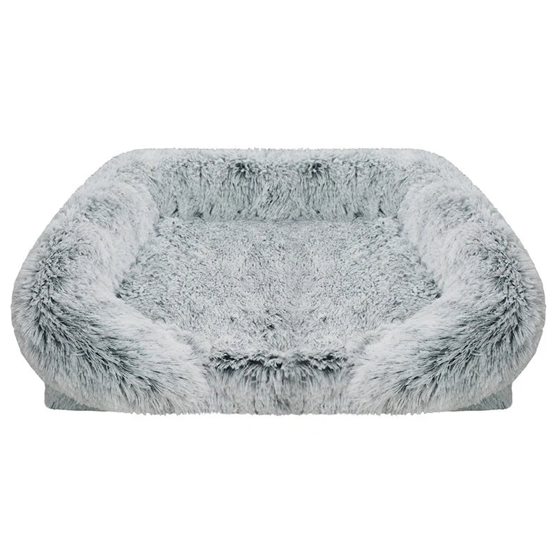 Light grey long shaggy faux fur rectangular pet sofa bed with raised bolster sides and a flat cushioned center, shown from the front on a white background