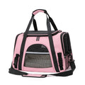 Pink pet carrier with black straps on a white background