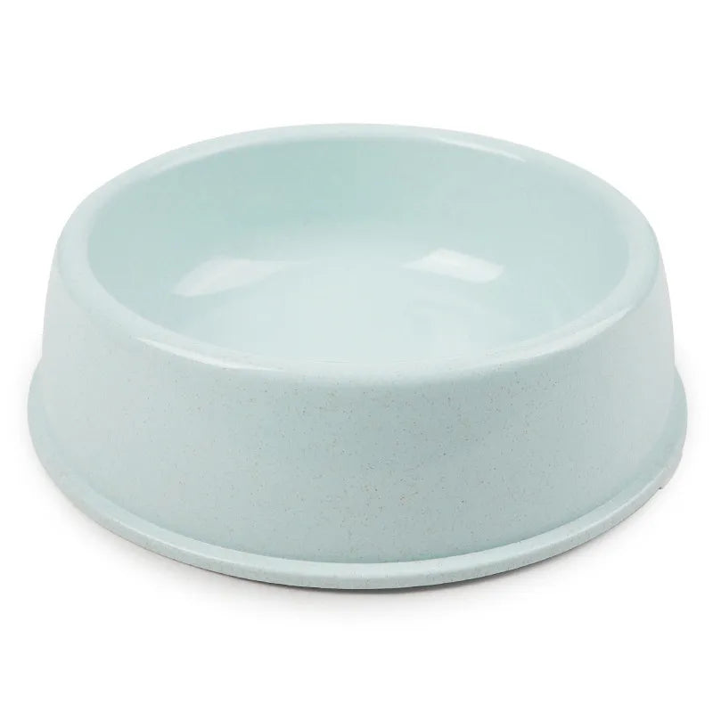 Simple light blue/mint single pet bowl, plain matte plastic or ceramic, product photo on white background