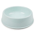 Simple light blue/mint single pet bowl, plain matte plastic or ceramic, product photo on white background