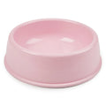 Simple pastel pink single pet bowl, plain matte plastic or ceramic, product photo on white background