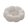 A plush, cloud-like pet bed with a scalloped, flower-petal border and a soft, circular cushion inside, shown on a solid white background.