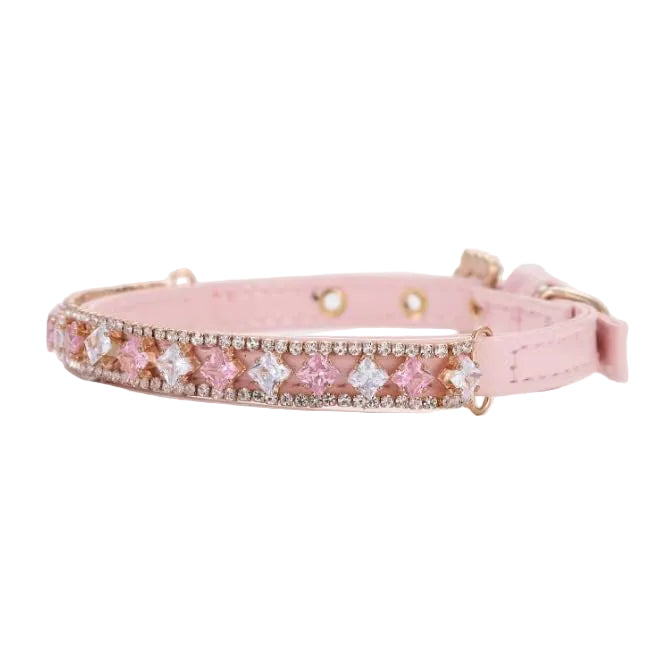 Pretty Posh Pets luxury rhinestone pet collar — full view of a pink leather collar featuring alternating princess-cut pink and clear crystal gemstones set in rose gold, bordered by rows of sparkling round rhinestones, with a rose gold buckle and D-ring on a white background.