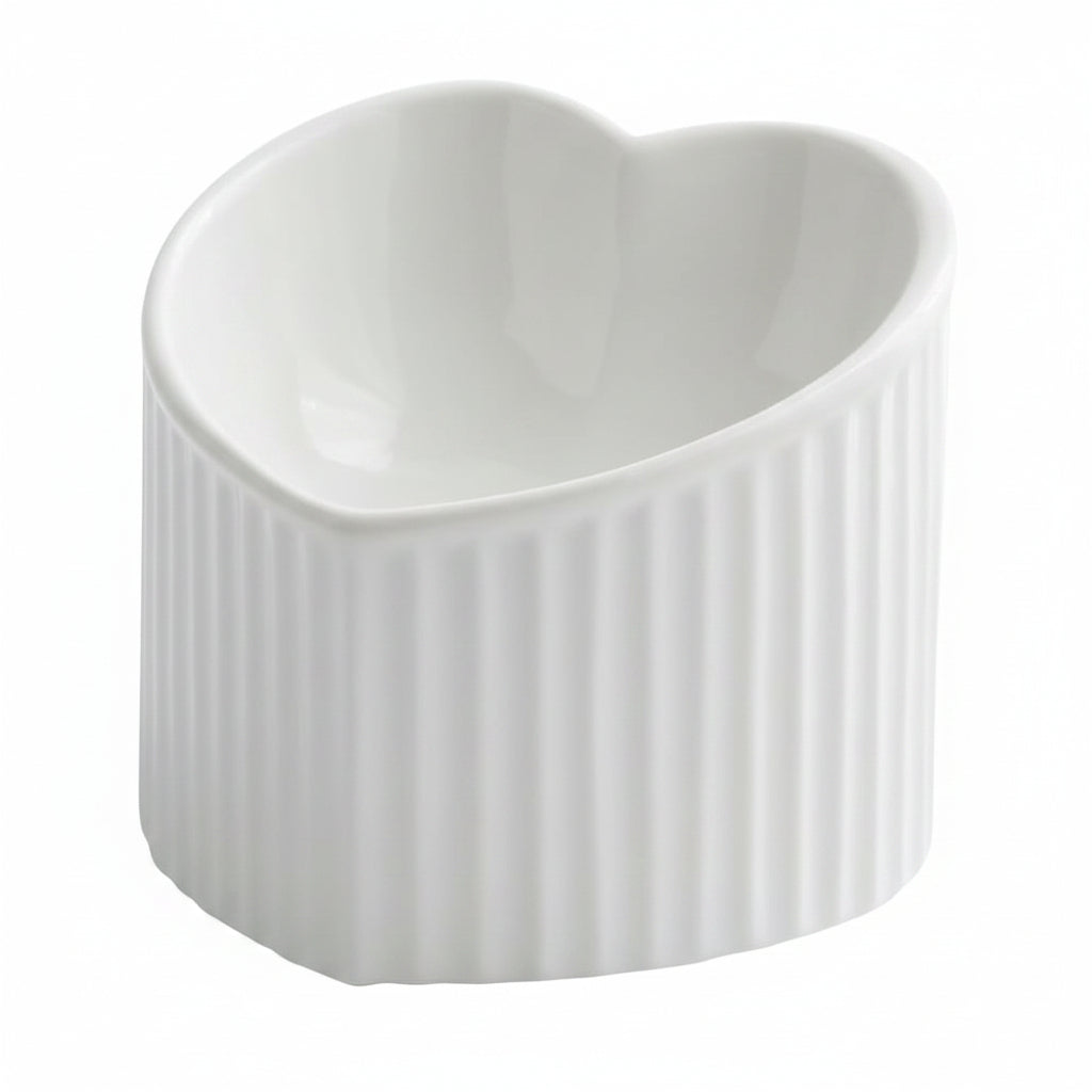 White ceramic heart-shaped pet bowl with ribbed exterior, white background

