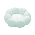 A fluffy, cloud-shaped pet bed in a pale mint green color, isolated on a solid white background.