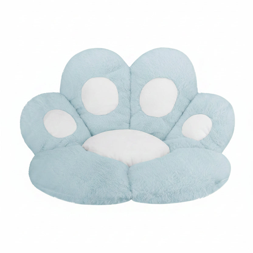 Powder blue and white plush paw-shaped pet bed cushion with white toe pad accents, shown from a front-facing angle on a white background