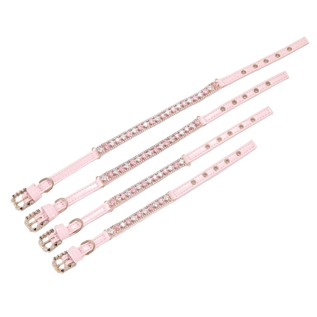 Pretty Posh Pets luxury rhinestone pet collar size comparison — four pink leather collars in XS, S, M, and L sizes displayed side by side, each featuring alternating princess-cut pink and clear crystal gemstones set in rose gold with round rhinestone borders, showing the range of adjustable sizing on a white background.