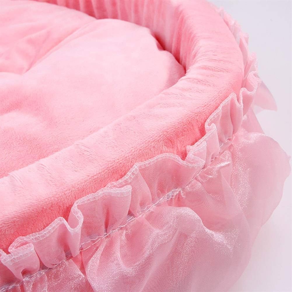 Close-up detail shot of pink velvet ruffle pet bed showing layered chiffon lace ruffle trim and plush velvet fabric texture, white background