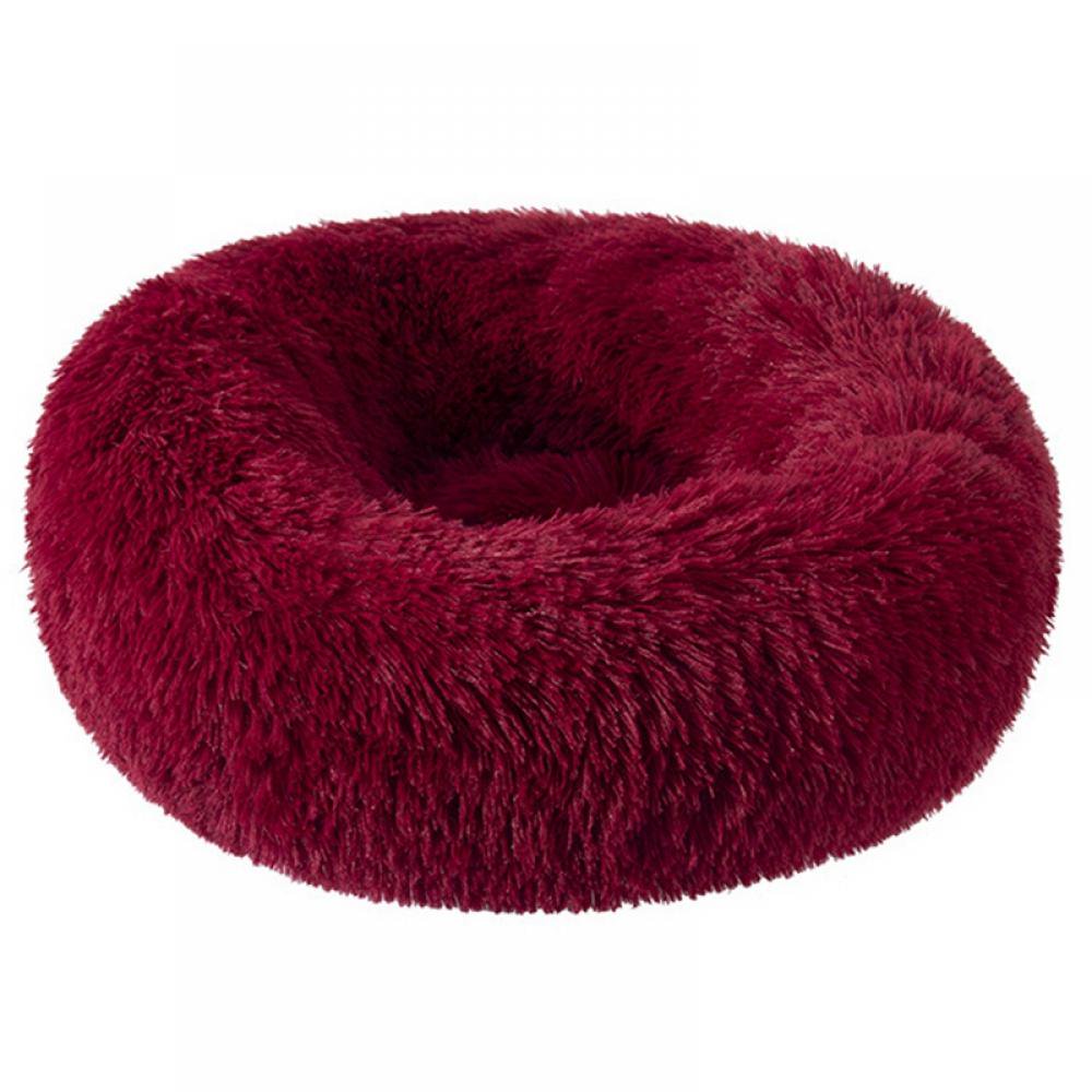A plush, donut-shaped pet bed in a deep burgundy or dark red faux fur material, shown against a plain white background.