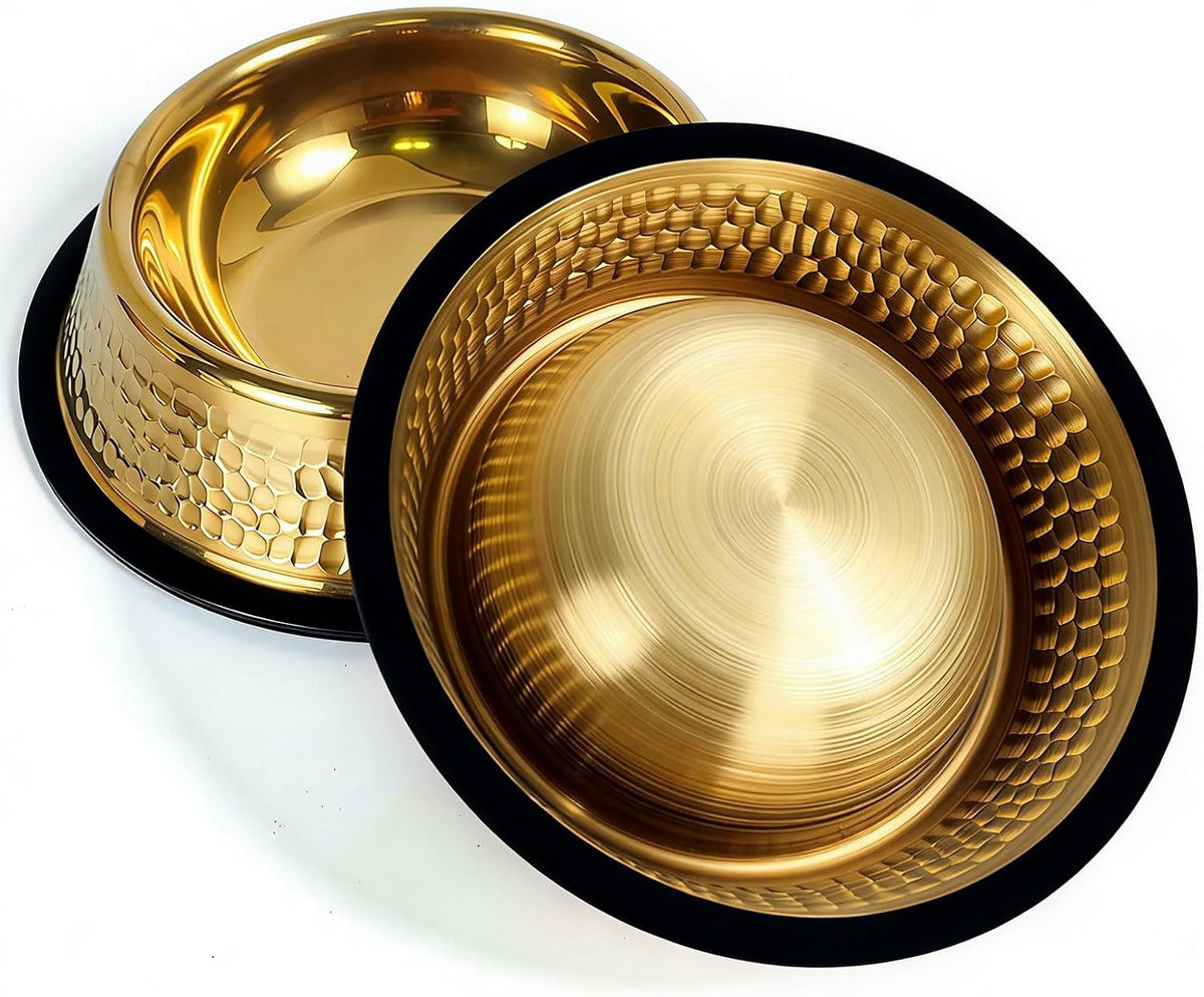 Two metallic gold pet bowls with black rims, one showing a hammered exterior and the other showing a smooth brushed interior, on a white background.