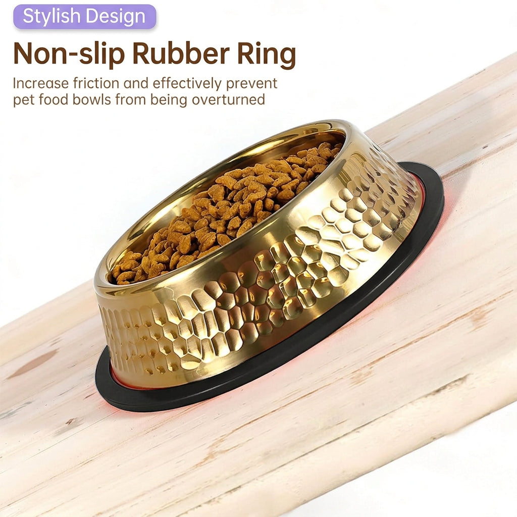 Gold pet food bowl with a textured exterior, filled with kibble, resting on a black non-slip rubber ring over a light wood surface. Text at the top reads 'Stylish Design' and 'Non-slip Rubber Ring' with a descriptive subtitle.