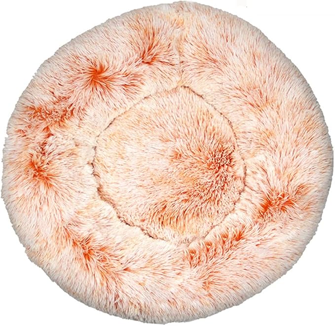 Round cream and orange tie-dye shaggy faux fur donut calming pet bed top-down view on white background