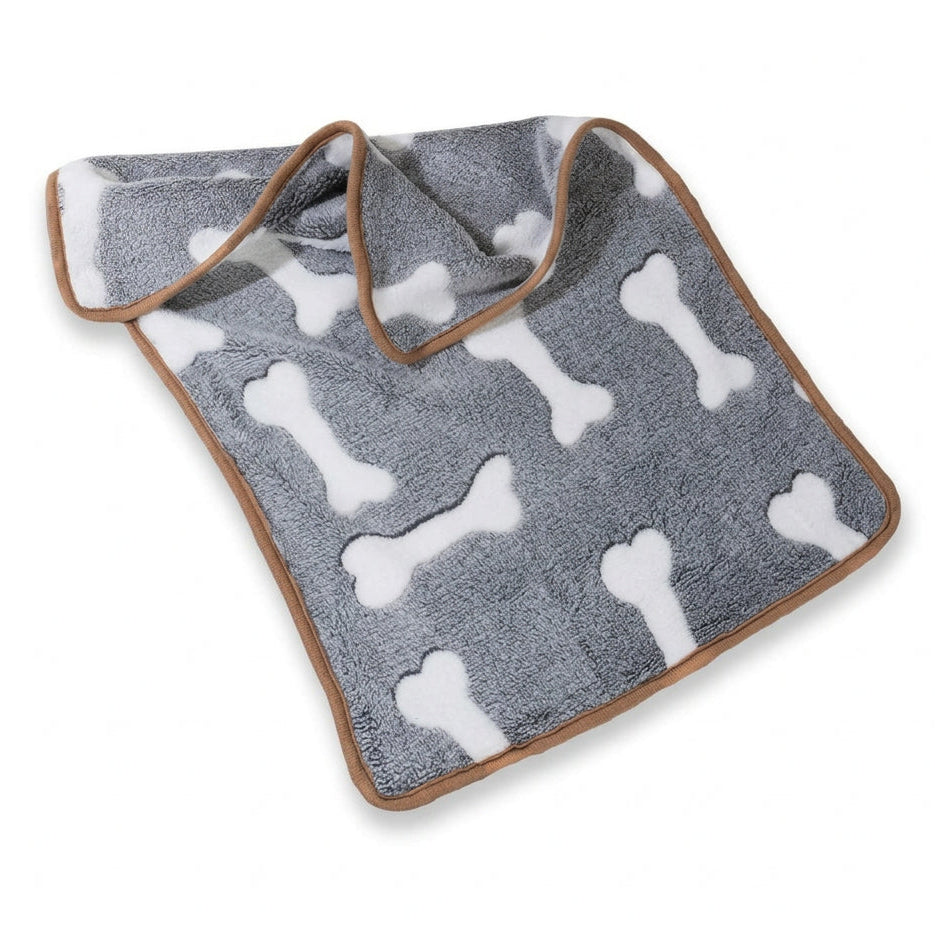 A gray plush pet blanket with white bone patterns and a brown trim, shown on a plain white background.