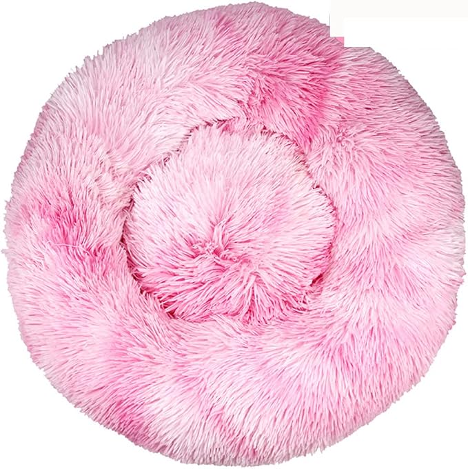 Round pink tie-dye shaggy faux fur donut calming pet bed on white background