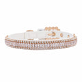 Pretty Posh Pets luxury rhinestone pet collar — front-facing view of a white leather collar featuring a row of emerald-cut clear crystal baguette gemstones bordered by two rows of sparkling round rhinestones in rose gold settings, with an adjustable buckle and eyelets on a white background.