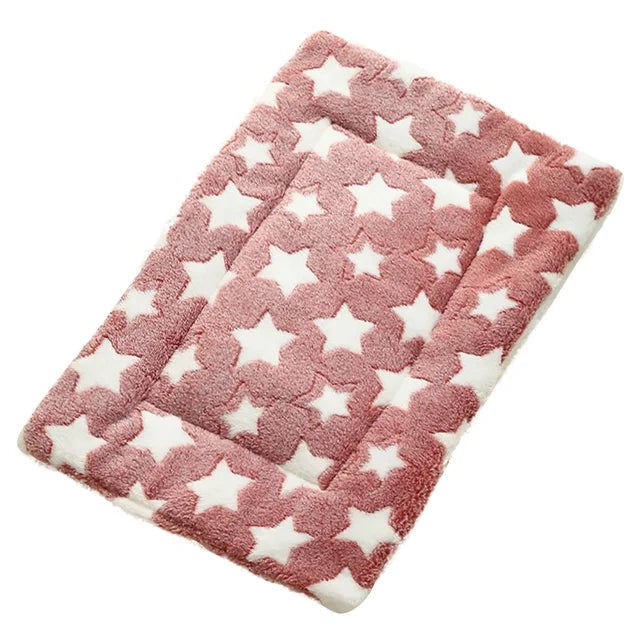 Dusty rose pink plush pet mat with white star print pattern on white background