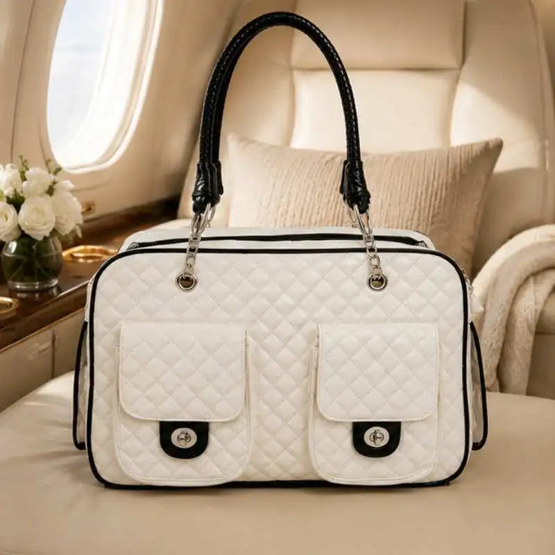 White quilted pet carrier with black accents on a luxurious interior background