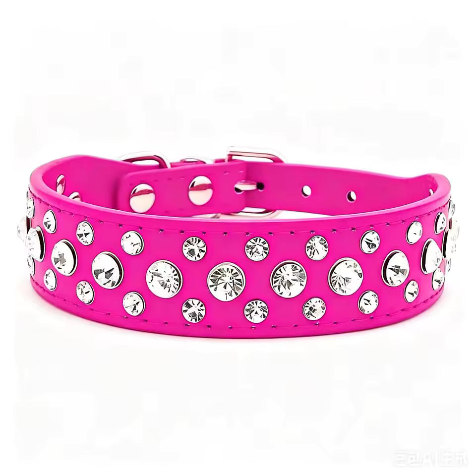 A bright pink dog collar embellished with multiple round silver rhinestones, shown against a plain white background.