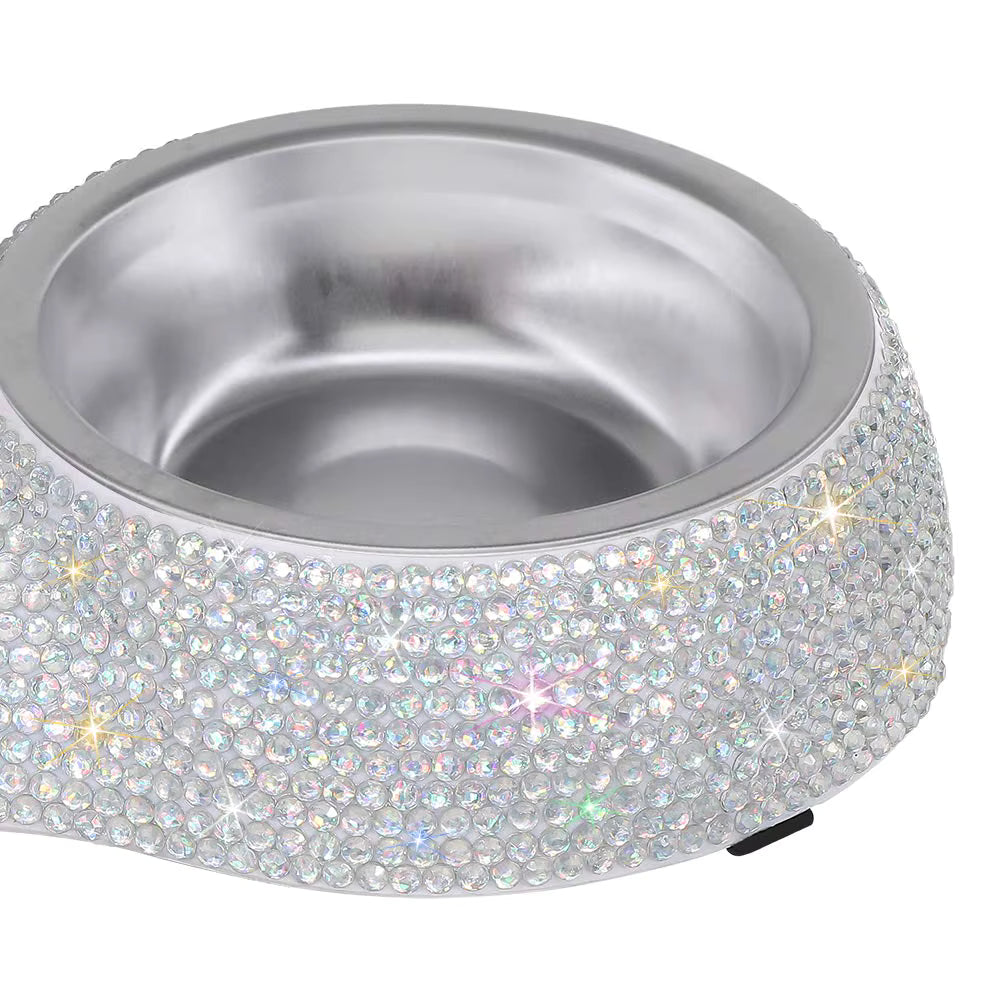 Silver pet bowl with sparkling rhinestone embellishments on a white background