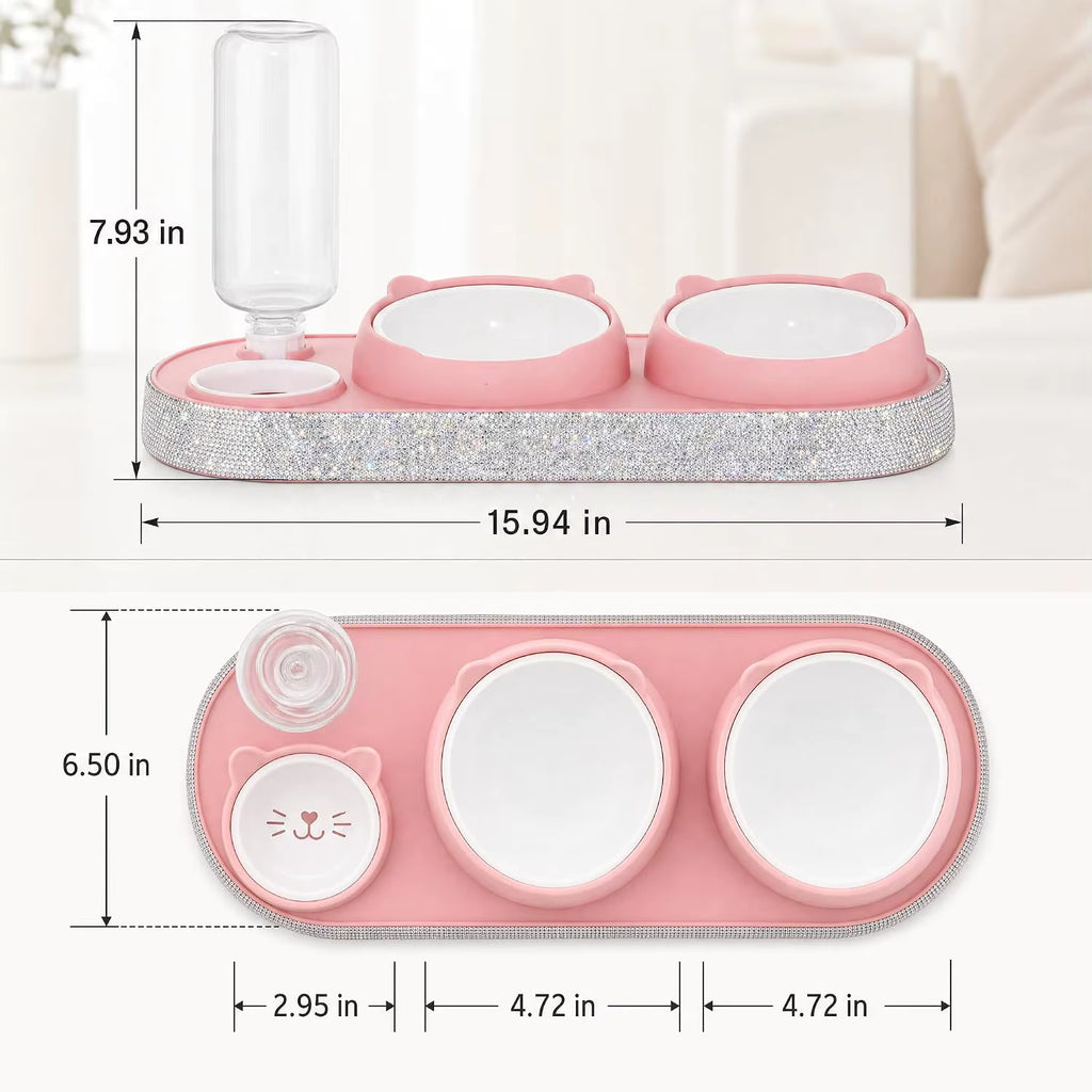 Pink pet feeding station with two bowls, a small cat-face bowl, and a clear water bottle holder, shown with dimension lines and measurements on a light indoor background.