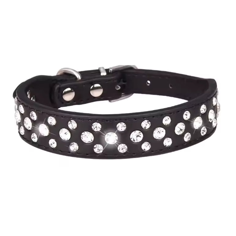 A black faux-leather dog collar embellished with clear rhinestones, featuring a silver-tone metal buckle and rivets, shown against a plain white background.