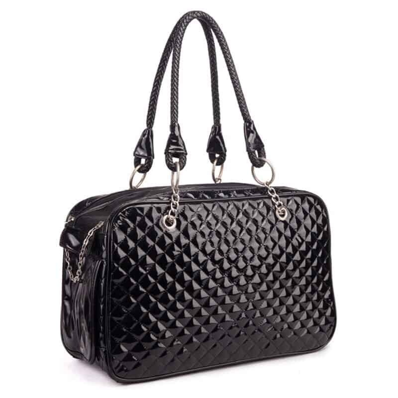 Black quilted pet carrier with braided handles on a white background