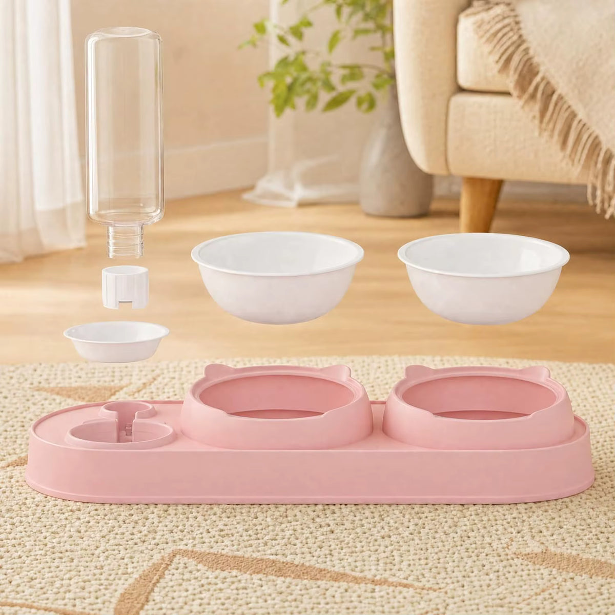 Pink pet feeding station with two bowls, a water bottle, and a small dish shown floating above a beige woven rug in a softly lit living room.