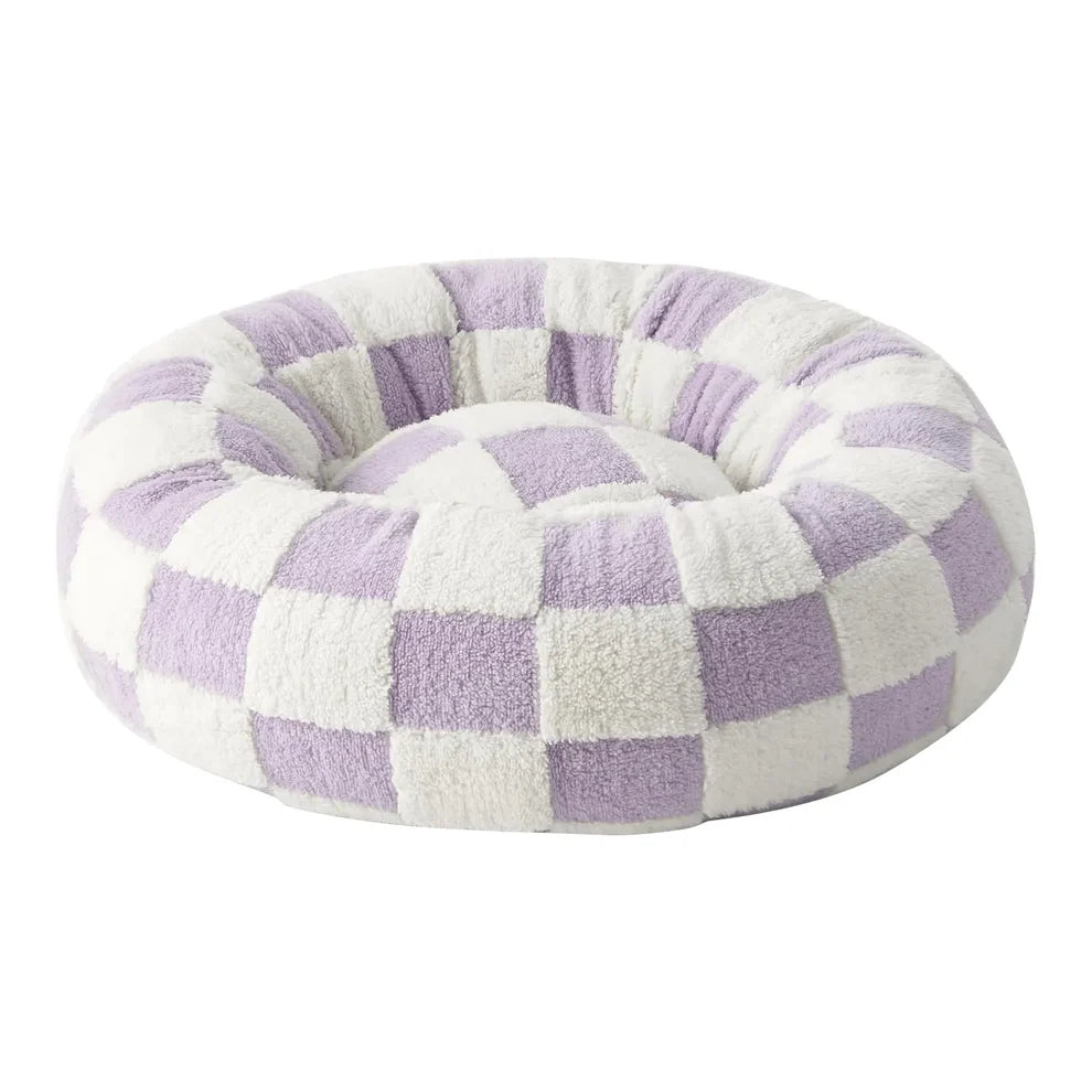Lavender and cream checkered plush round donut pet bed shown at a 3/4 angle on a white background