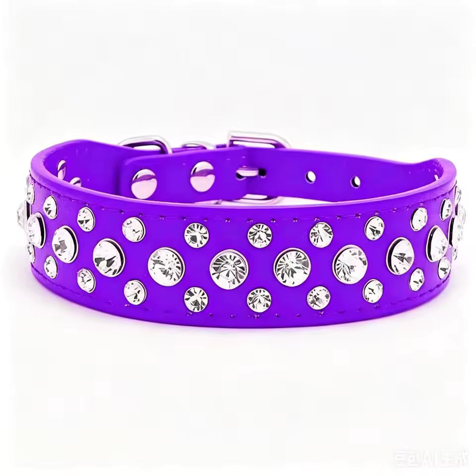 A bright purple dog collar embellished with multiple round silver rhinestones, shown against a plain white background.