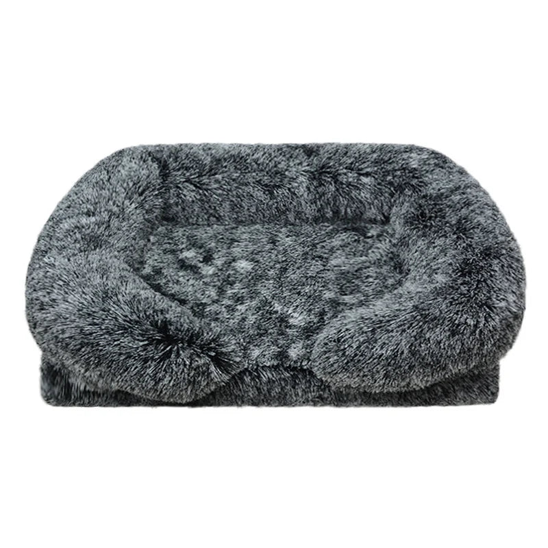 Charcoal grey long shaggy faux fur rectangular pet sofa bed with raised bolster sides and a flat cushioned center, shown at a slight angle on a white background