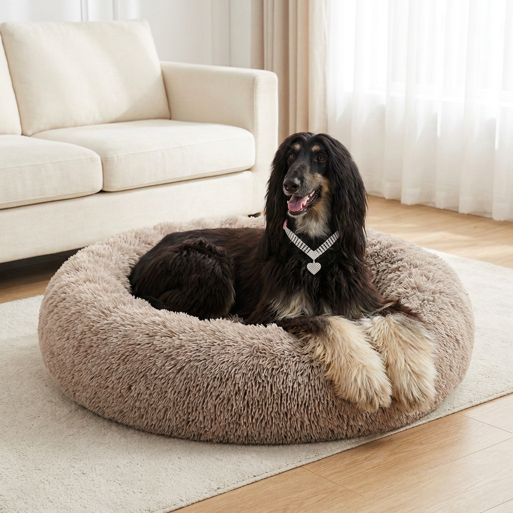 Afghan hound on the taupe bed wearing the Pink Rhinestone Heart Pendant collar