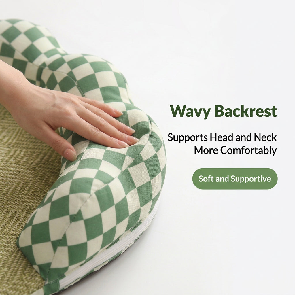 A green and cream checkered lumbar pillow pet bed with a wavy shape, shown with a hand pressing into the soft cushion. Text on the right reads 'Wavy Backrest Supports Head and Neck More Comfortably'.
