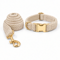 Beige teddy fleece set with coiled leash on the left and collar on the right