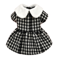 Black-and-white houndstooth pet dress on a square white background