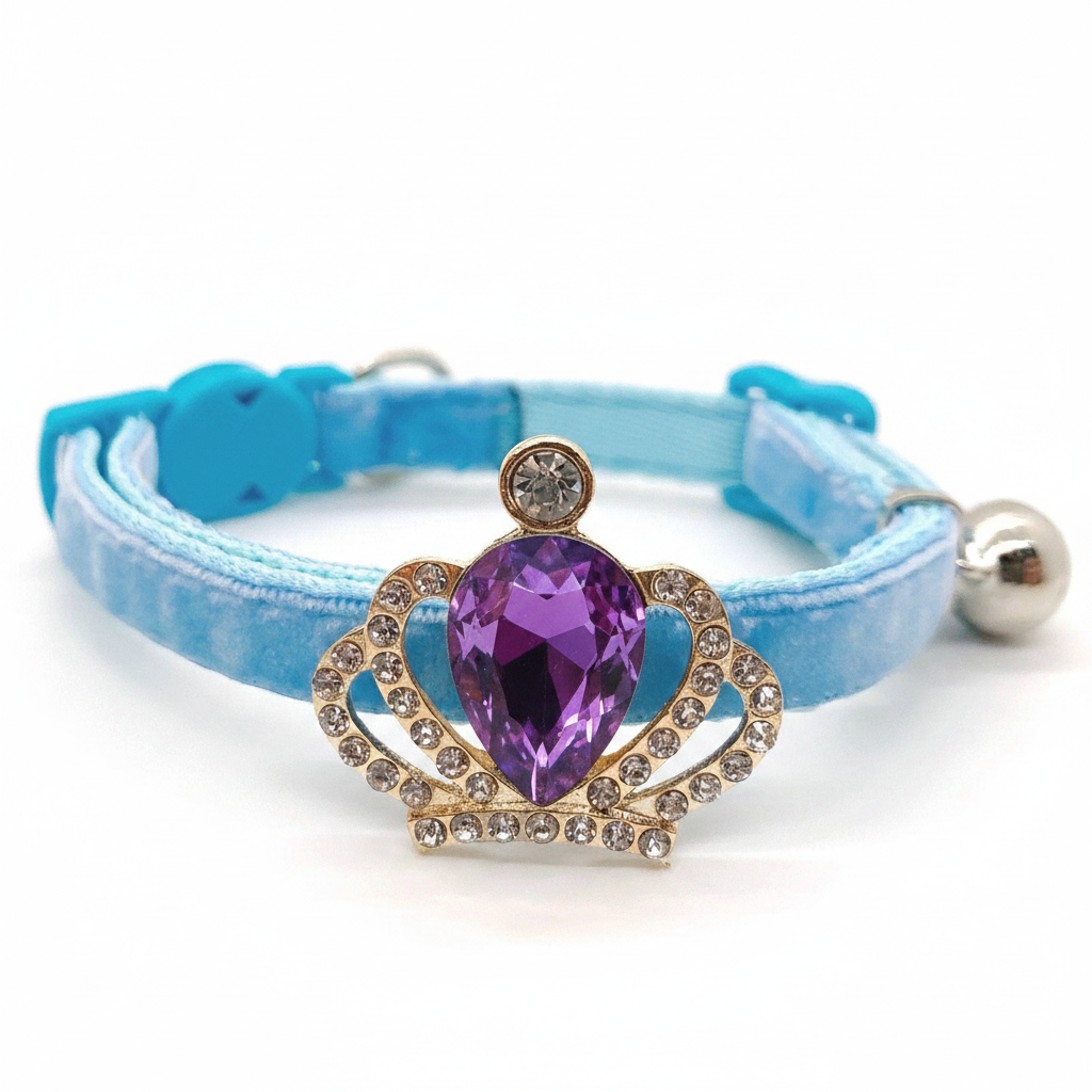 Sky blue velvet cat collar with gold crown pendant, large purple amethyst teardrop gem, rhinestone accents, safety breakaway buckle and silver bell — luxury cat collar