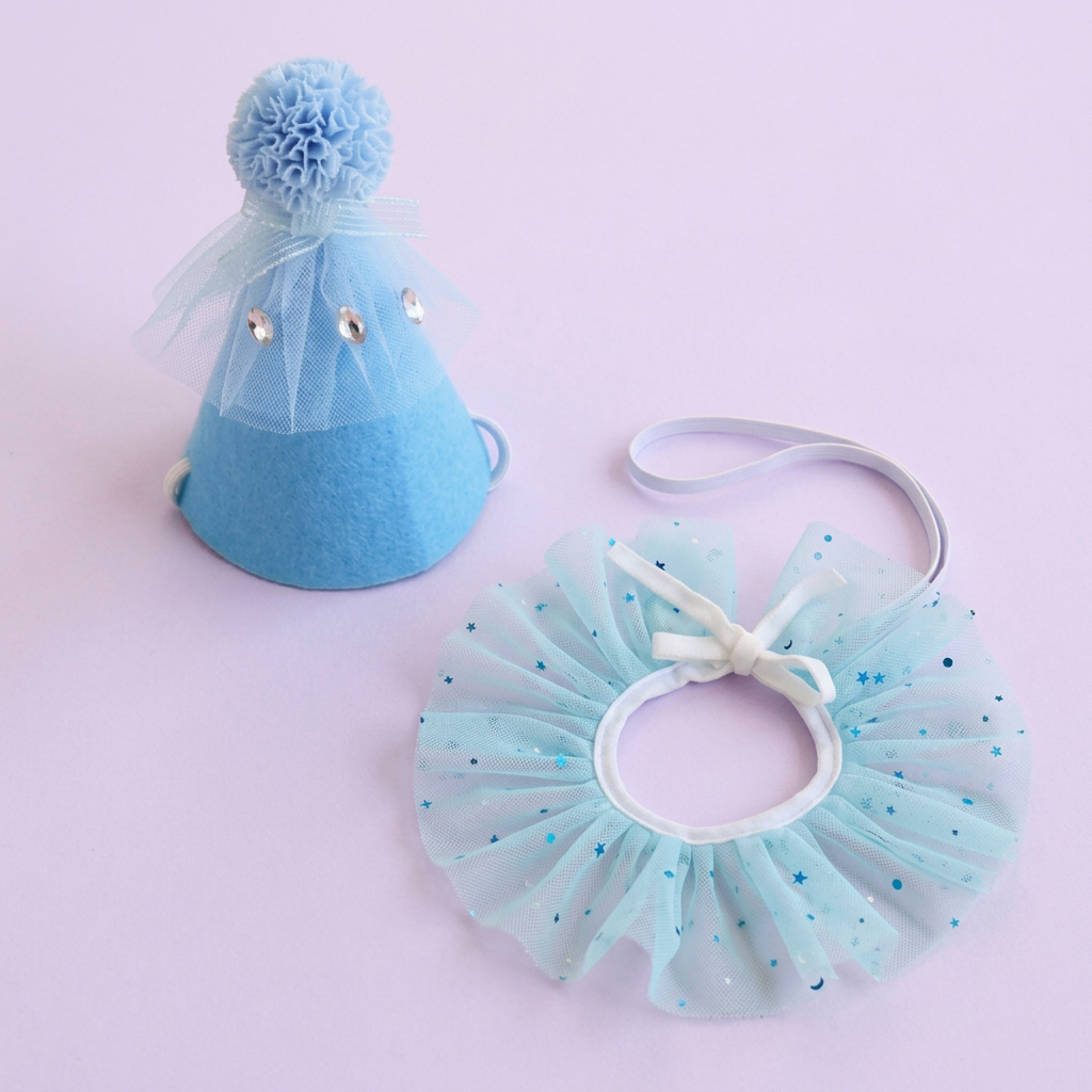 Blue party set on a very light lavender square background