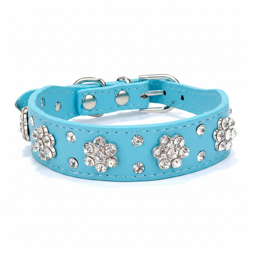 Blue rhinestone flower dog collar with sparkling floral embellishments, shown against a soft lavender studio background.