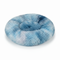 Round blue and white tie-dye shaggy faux fur donut calming pet bed three-quarter view on white background