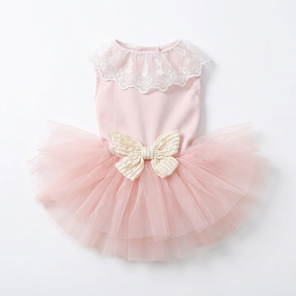 Blush pink pet dress laid flat on a square white background