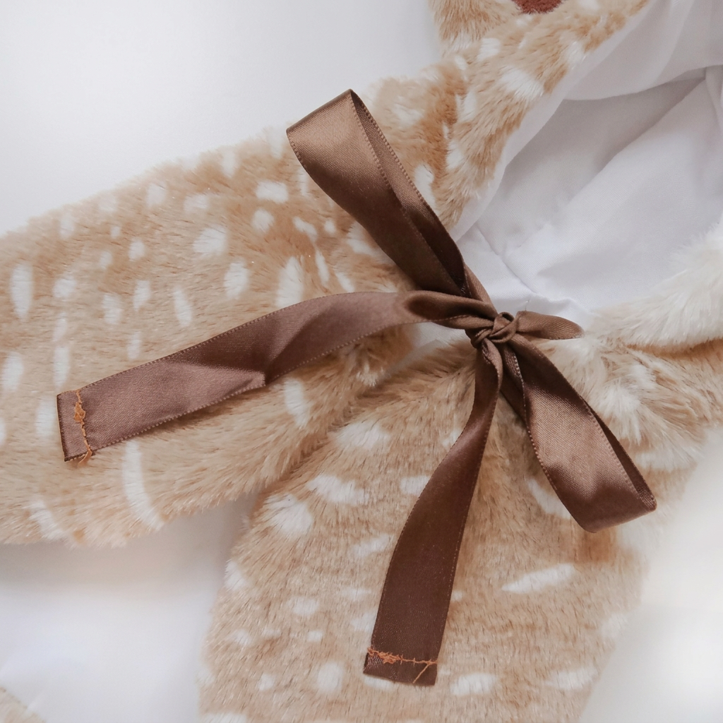 Brown satin bow detail on white