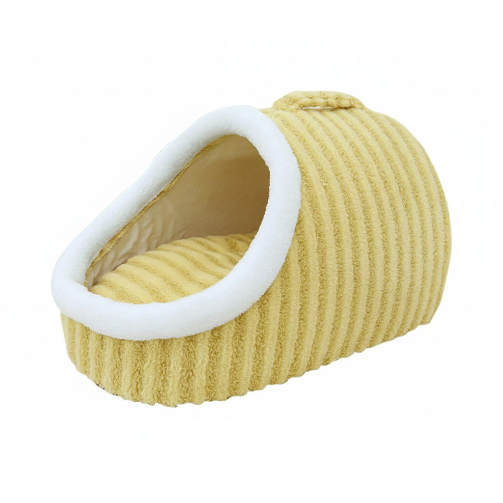Butter yellow corduroy cave pet bed with a white fleece-lined oval opening and carry handle, photographed on a white background.