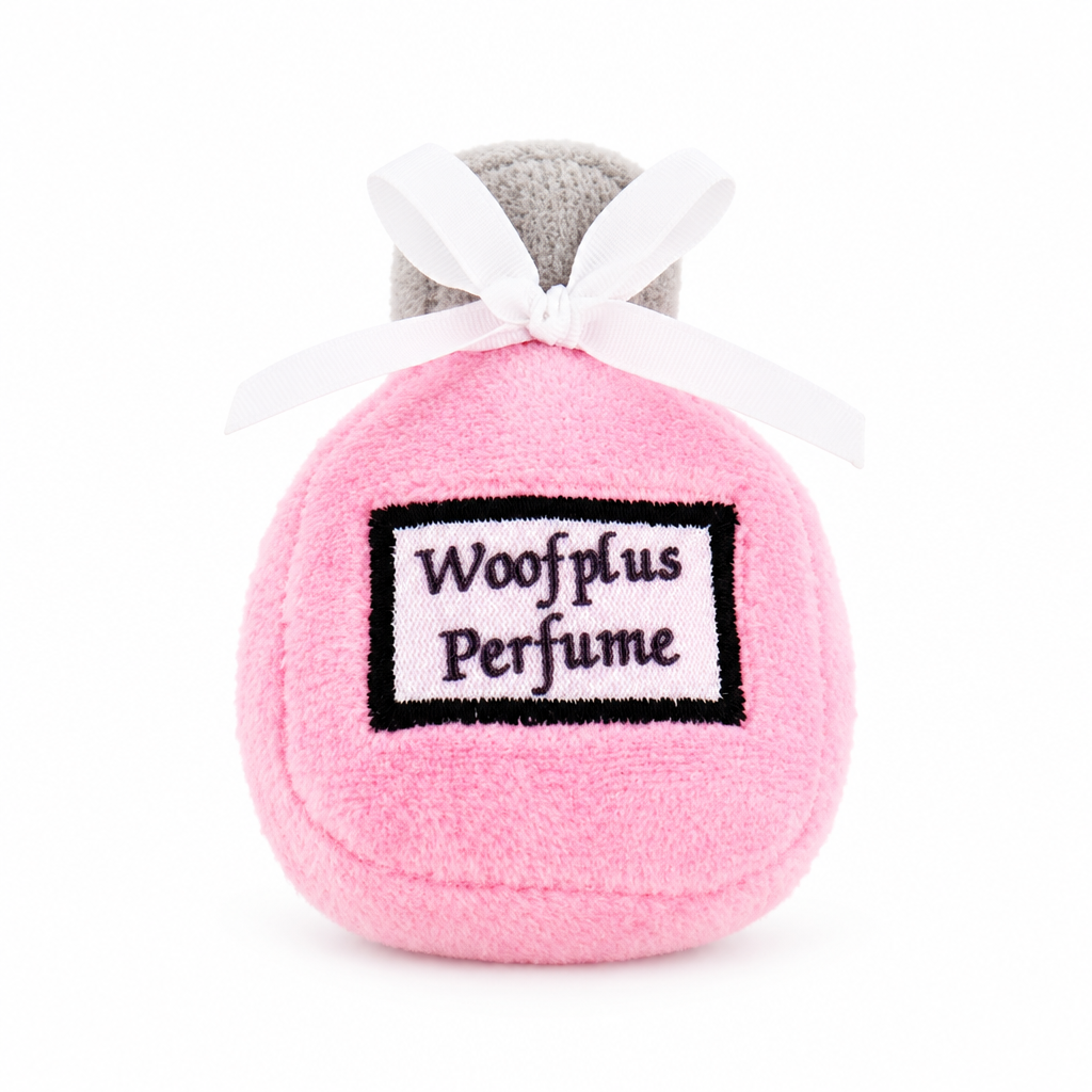 Centered pink perfume plush on a white background, with the surrounding text removed