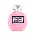 Centered pink perfume plush on a white background, with the surrounding text removed