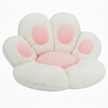 Cream white and blush pink plush paw-shaped pet bed cushion with pink toe pad accents, shown at a slight angle on a white background