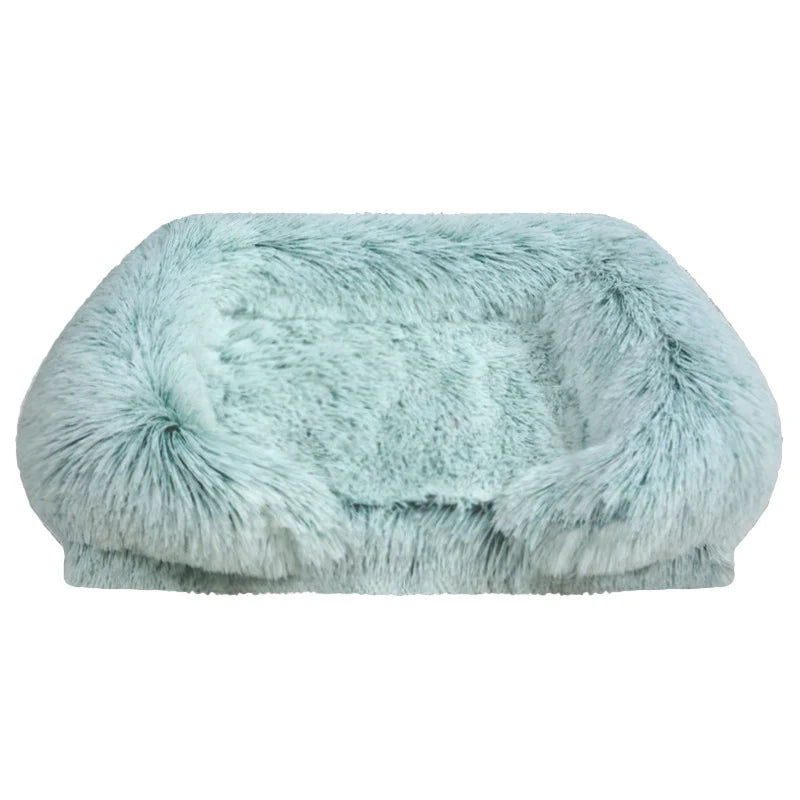 Mint green long shaggy faux fur rectangular pet sofa bed with raised bolster sides and a flat cushioned center, shown from the front on a white background