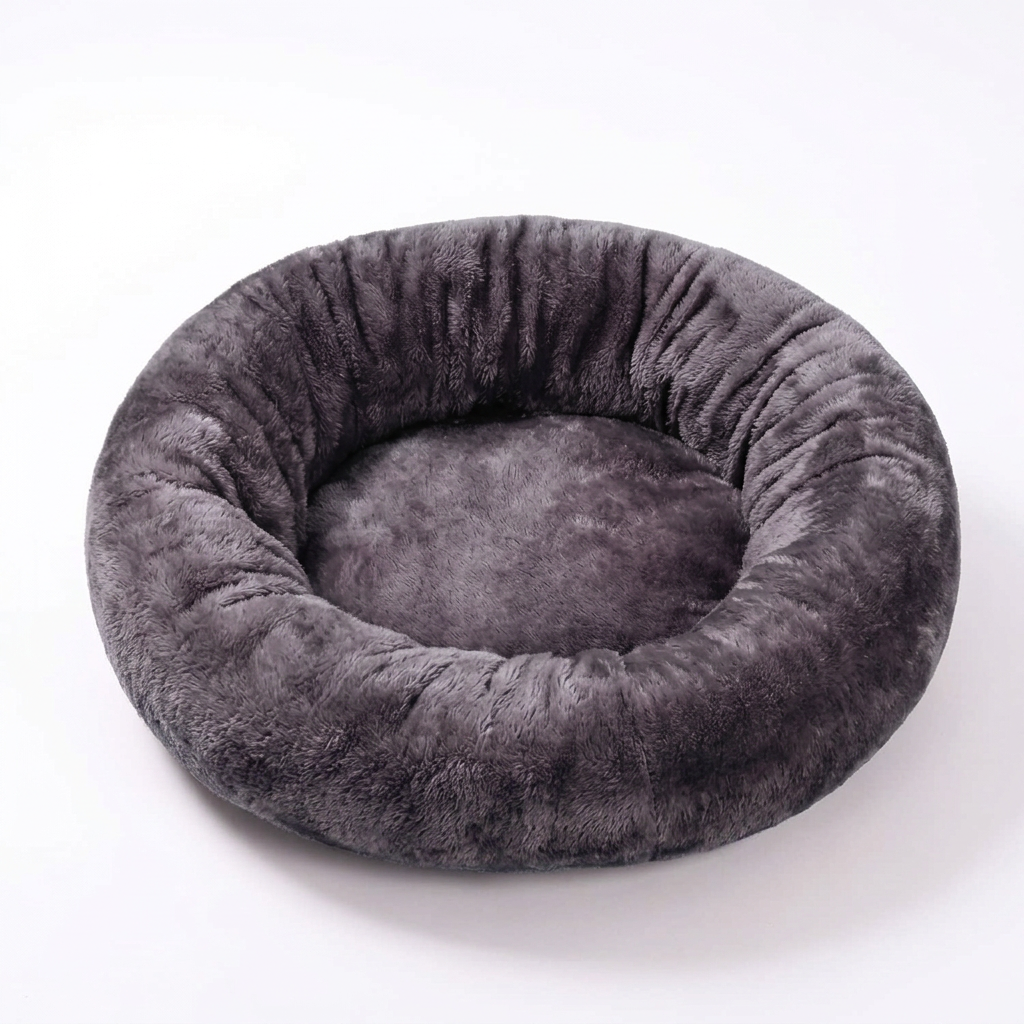 Dark gray plush donut pet bed on a white background