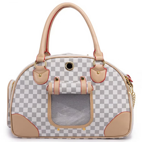 A pet carrier handbag with a gray and white checkerboard pattern, beige leather handles and trim, and a clear front window, shown on a white background.