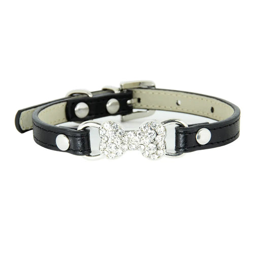 Black leather dog collar with a decorative bone and crystals on a white background