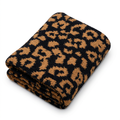 Folded blanket in black-and-tan leopard print