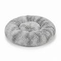 Round grey tie-dye shaggy faux fur donut calming pet bed top-down view on white background